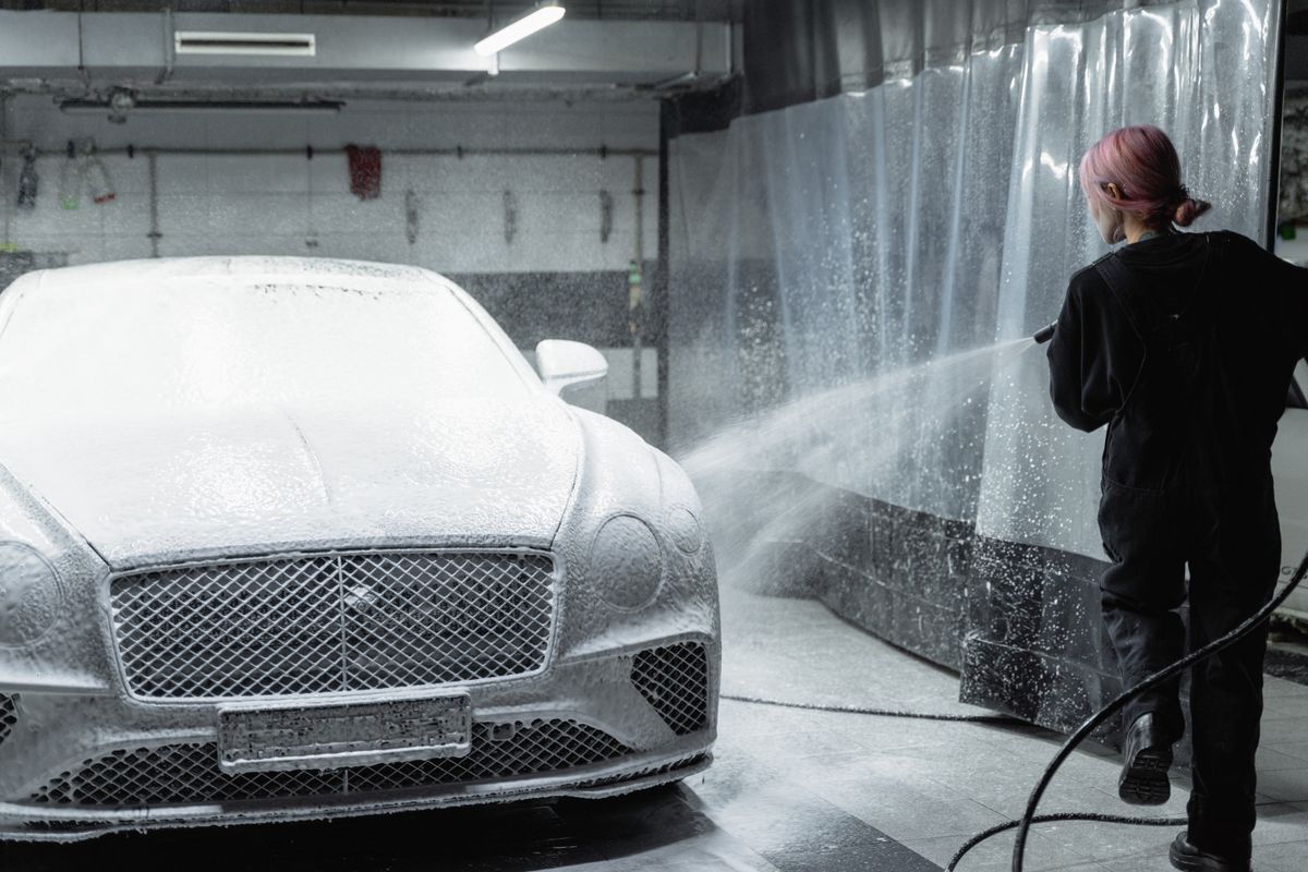 Vehicle being pressure washed