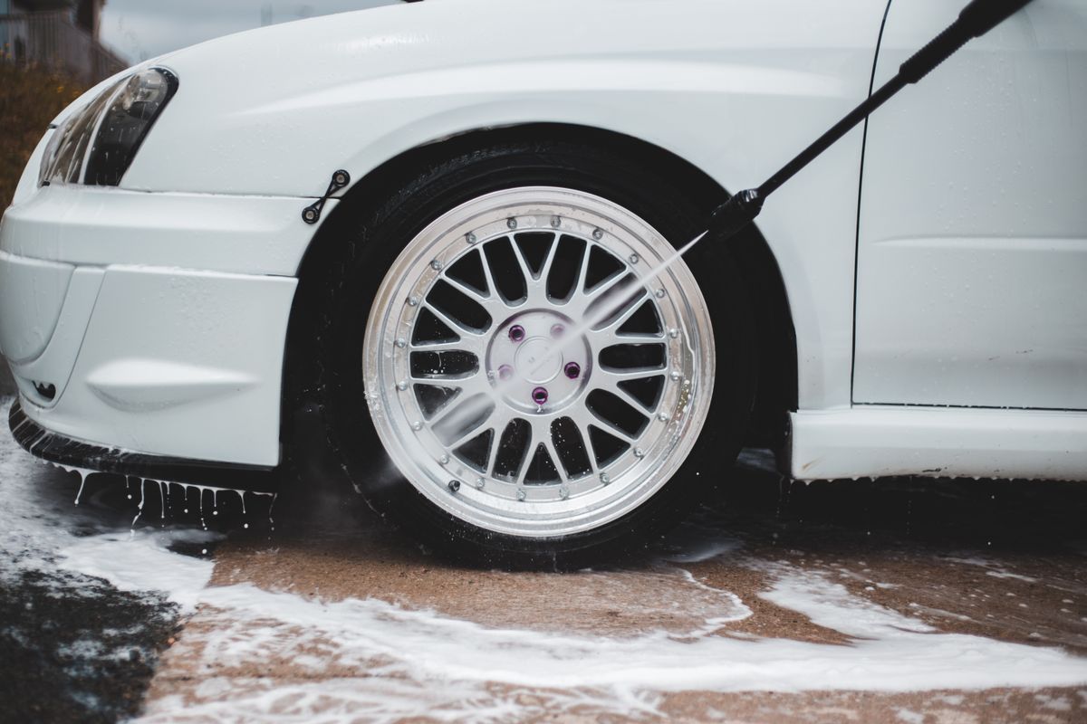 Car wheel being cleaned